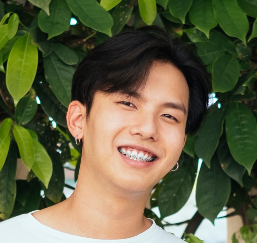 Smiling patient with braces showcasing orthodontic treatment in Tigard.