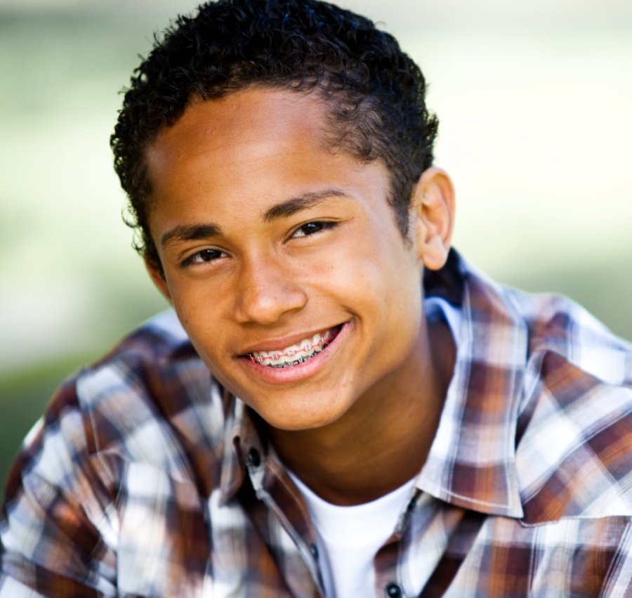 Smiling teenager with braces, showcasing orthodontic treatment in Tigard.